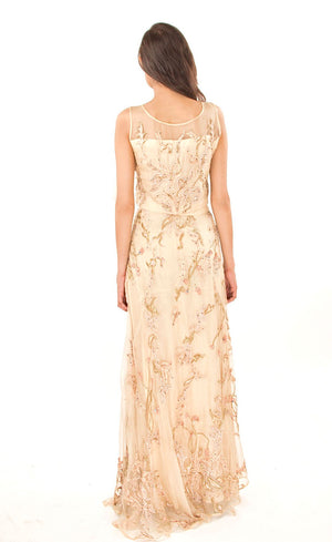 This is our champagne cropped top with A line skirt set. It is fully embroidered with silk threads, beads, sequins, golden work and appliqué details. This skirt set is intricately embroidered with 24 different embroidery techniques done all over the lehenga skirt, truly making it a one of a kind outfit. This as a whole presents a delicate feminine look with a carefree and effortless ensemble, perfect for all occasions.