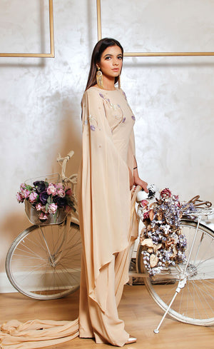 A beautiful silhouette with long asymmetrical flowing sleeves making a key elegant feature of this garment.