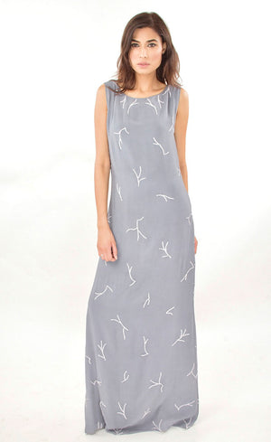 This is our simple and elegant straight gown. It is intricately hand embroidered with silk threads and beads all over. This understated mineral grey gown is perfect example of minimalistic beauty and hence best for you to glam up any occasions.