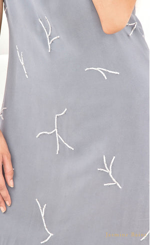 This is our simple and elegant straight gown. It is intricately hand embroidered with silk threads and beads all over. This understated mineral grey gown is perfect example of minimalistic beauty and hence best for you to glam up any occasions.