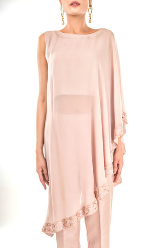 This is our naturally beautiful and effortlessly elegant hazelnut side cape trouser-set. Crafted asymmetrically in georgette this one shoulder cape is intricately embroidered with bead-work embroidery and sequins along flowy flared border of the cape which is further paired with cupro straight trousers with metal buttons finishing on the bottom cuff sides.