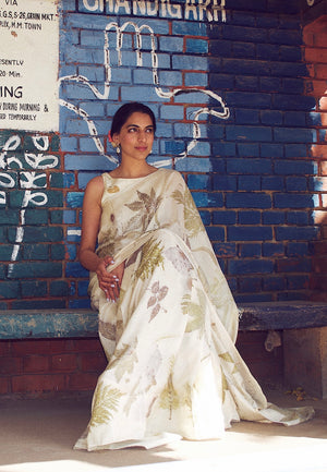 Eco Printed Sari  Style Code: JBSS23C03  Details:   Hand-printed by using natural leaves from the forest on hand-woven pure mulberry silk.   100% Mulberry Silk  Blouse with a modest boat neckline   Pieces include Sari, Blouse (can be customized), Petticoat   Hand-printed in Chandigarh, India