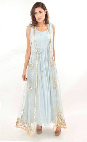 The muse here is wearing our floor length gown with an embroidered gilet / jacket. Embracing the era of comfort this dress is nothing short of luxury and glamour. It is a silk chiffon gown with a tulle net jacket overalls which is fully embroidered in our signature gota appliqué, silk threads, beads and sequins embroidery on the front and pressed gota at the border.