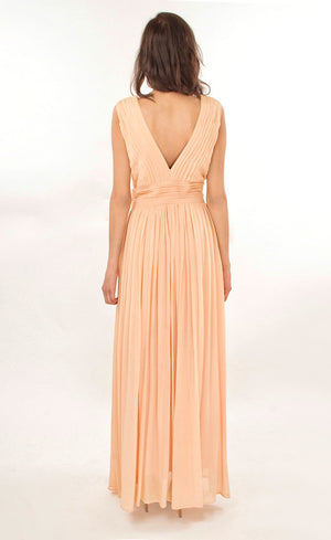 This nude elegant flowy floor-length gown has simple v-neckline bringing out a certain amount of boldness and self assurance. It is pin-tucked at the yoke and waistline making it an ideal go-to gown for any evening cocktail event.