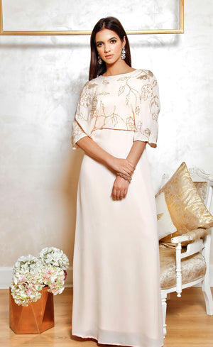 This beautiful powder pink - with just a hint of pink in the hue, is an absolute minimalistic design crafted into a floor length gown.