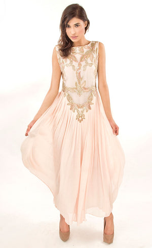 The muse here is wearing our powder pink gown. This gown is fully embroidered with beads, sequins and gold work on the front as well as the back. It beautifully gathers around the waist creating an elegant flare for you when you walk. This classic gown with it's comforting style is a perfect companion for an evening event needs.