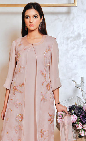A close up of the rose embroidery with delicate sequins fine craftsmanship.