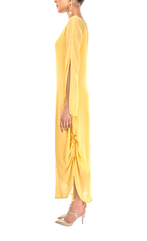 This is our tuscan yellow side drawstring dress which has all the flowy vibes which is a perfect dress for any event, bearing bead-work embroidery vertically on one sleeve and slit on the other to reveal your little glam and sparkly mood making it a beautiful lounge or an evening wear. The dress further has adjustable drawstring at one of it's sides providing a simple and elegant look.