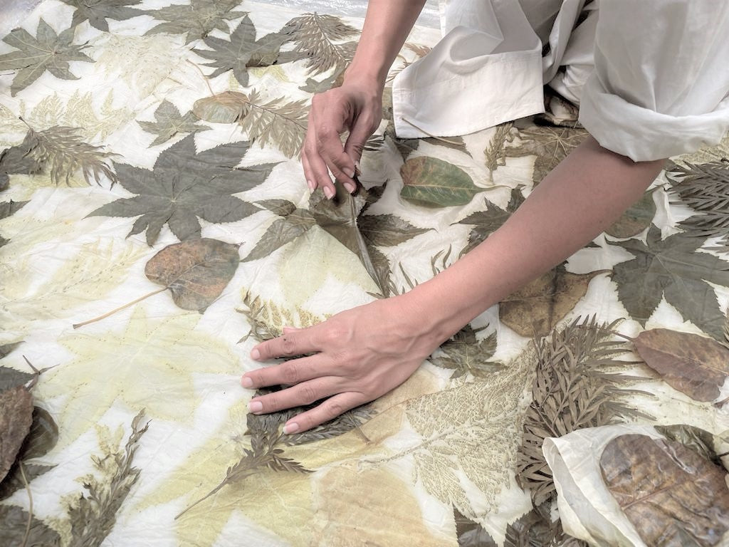 The image shows the process of removal of leaved to extract the print. This is the perfect eco-printed fabric which is environment friendly and sustainable.