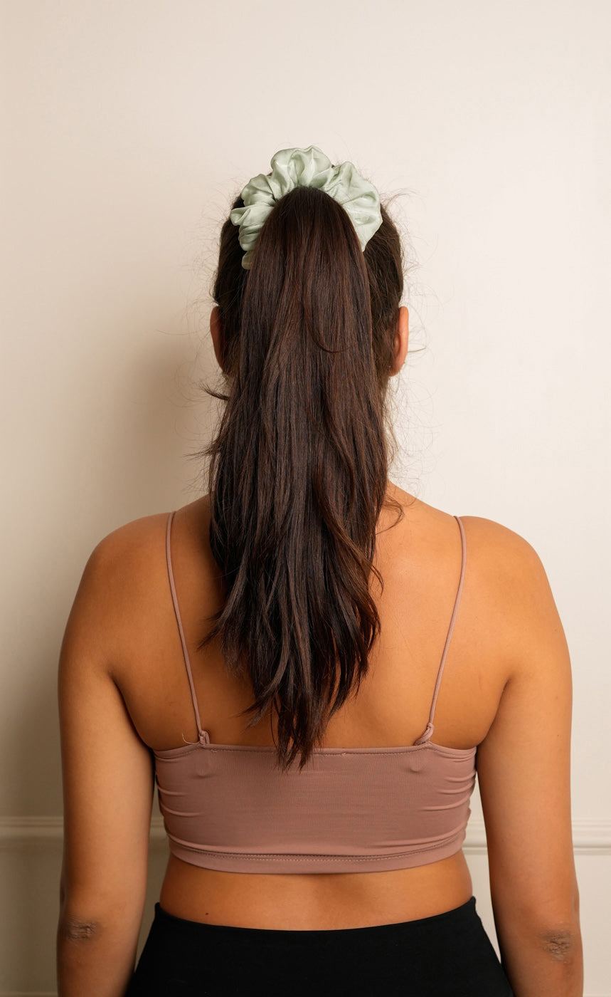 Back view of Candy Pink satin scrunchie styling updo — Jasmine Bains no-crease Bemberg satin hair accessory