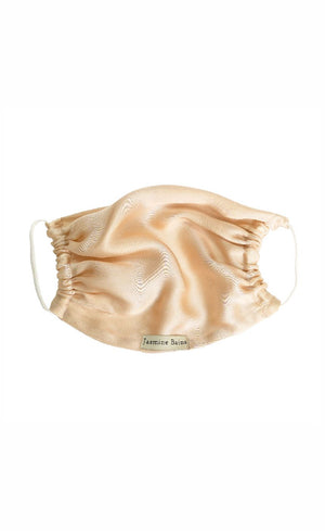 Gold face mask on a white background