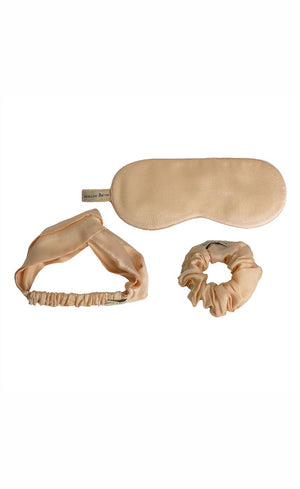 Beige Bemberg satin scrunchie and sleep mask laid flat showing fabric detail