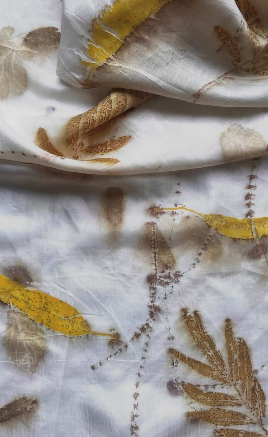 Ivory mulberry silk with turmeric-dipped leaf eco-printed motifs, handmade in Chandigarh, India
