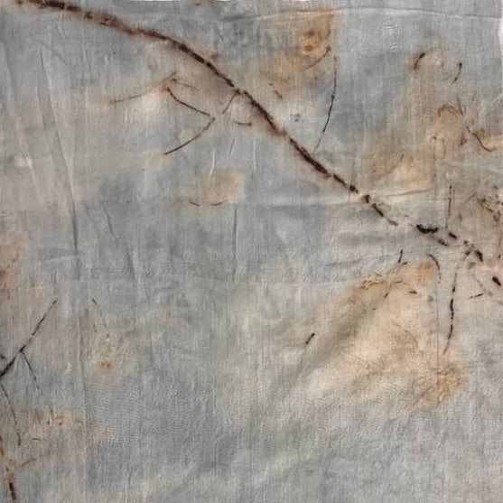 Marble-like surface with gray and beige colors and a dark crack running through it.