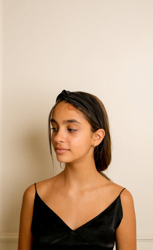 High quality black satin headband with a smooth, glossy finish. 