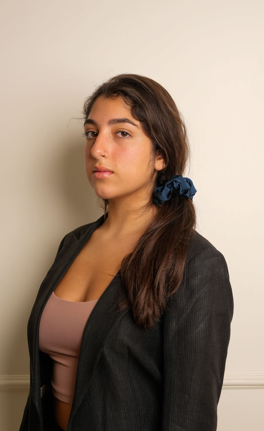 Three scrunchies in black, white, and navy on a white background