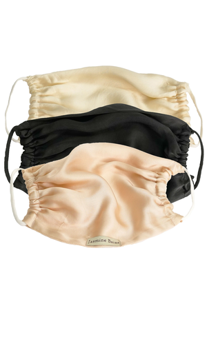 Pack of 3 luxury face masks - one beige, one ivory and one black, on a white background.