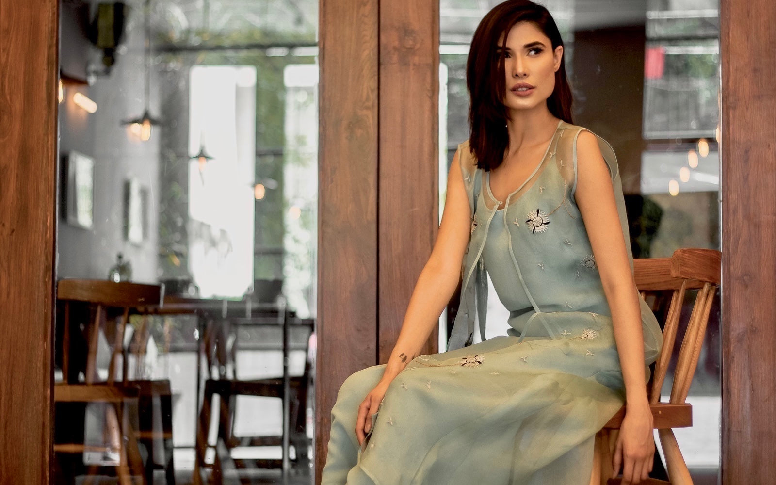 Jasmine Bains launches a beautifully classic Indian Kurta Jacket Dress set in sage green colour, The outer gilet / jacket is stitched in a sheer silk organza fabric that exudes light and weightless elegance into the garment. Accompanied with an inner slip