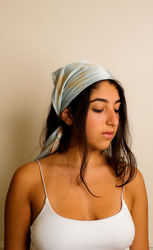 Marble Blue satin scarf worn as a headwrap, front view with white tank top