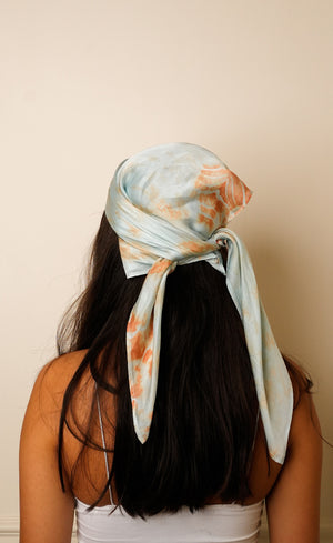 Back view of Bemberg satin headscarf in Marble Blue colourway, knotted at crown