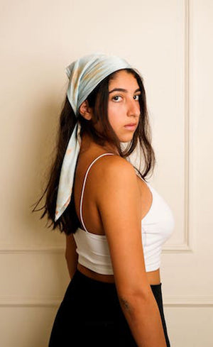 Marble Blue satin scarf tied as headscarf, side profile showing dye variation