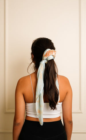 Bemberg satin scarf in Marble Blue worn as a headwrap, back view Bemberg satin scarf in Marble Blue worn as a headwrap, back view