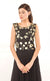 This black two-piece set is perfect for you to add into your collection. It comprises of a simple top with round neckline at the front and enhanced v-neckline at the back. It is intricately hand-embroidered with golden work silk threads, beads and sequins. This is further paired with a panelled skirt with perfect amount of flounce giving you a look that's both smart and eye-catching. 
