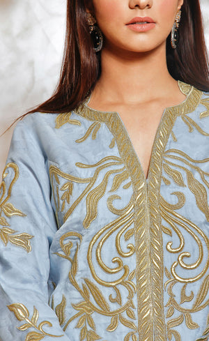 Blue grey organza short jacket fully embroidered with gold work with wide legged palazzos. 