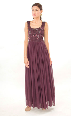 The muse here is wearing our naturally beautiful and elegant burgundy gown with laced yoke which is beautifully highlighted with beads as well as sequins and is gathered around the waistline providing the perfect amount of flounce, further enhancing the look and uniting comfort with elegance.
