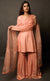 This is a beautiful burnt peach gharara suit set. The muse is wearing a simple yet an elegant kurta with yoke along the waistline paired with gharara having intricate  zari motifs on it. The suit-set is further accompanied by an organza dupatta with appliqué embroidery on it along the width and is finished with a raw silk border.