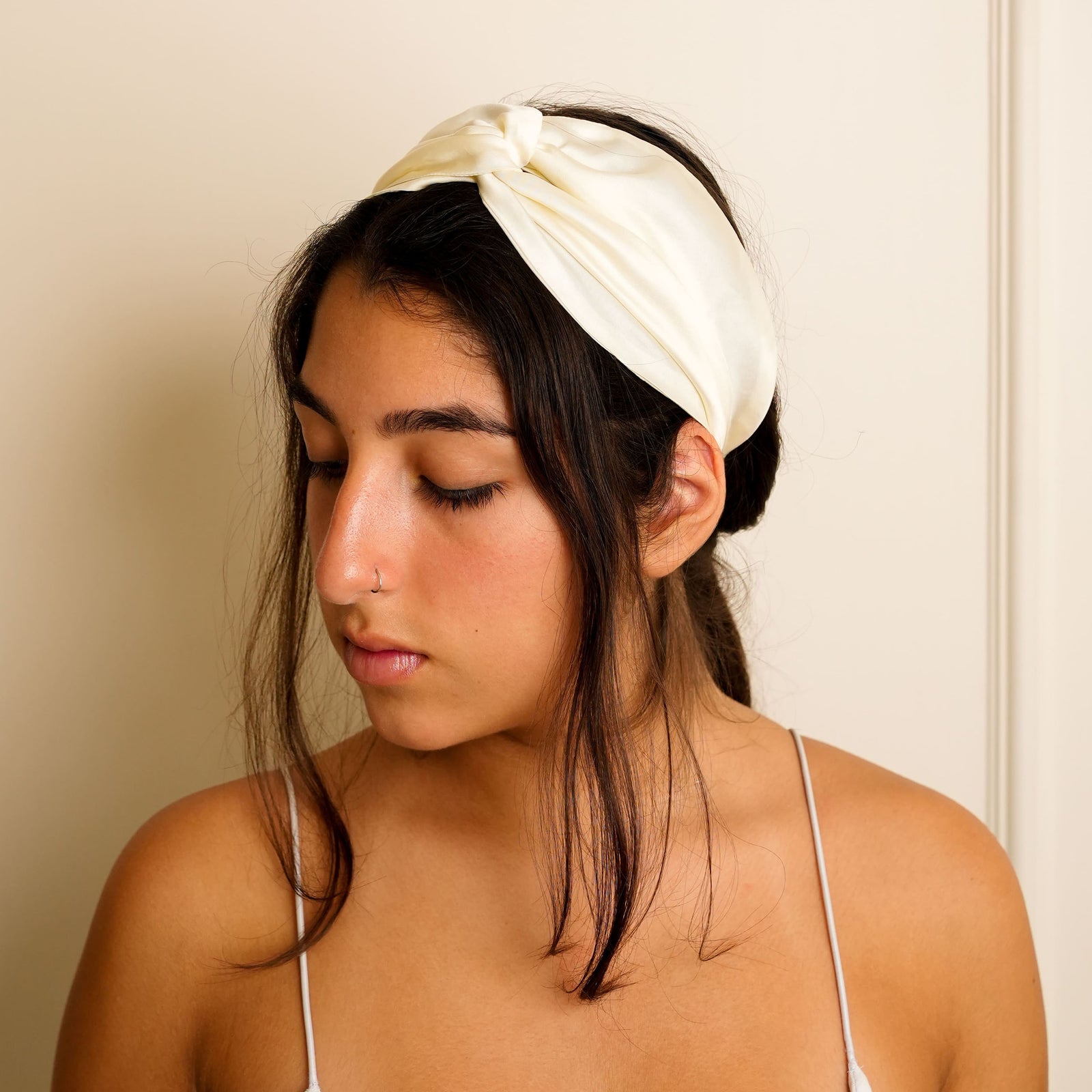 elegant ivory silk headband with a knot design