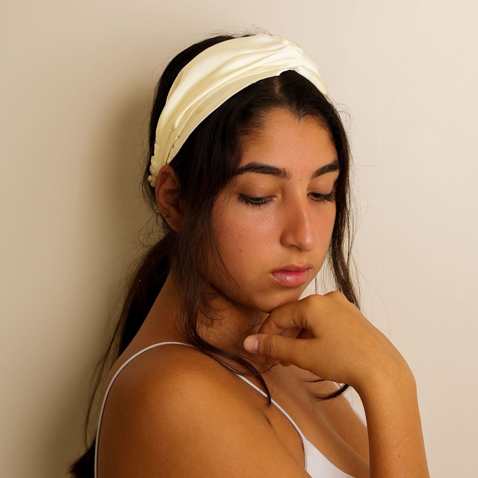 elegant ivory silk headband with a knot design