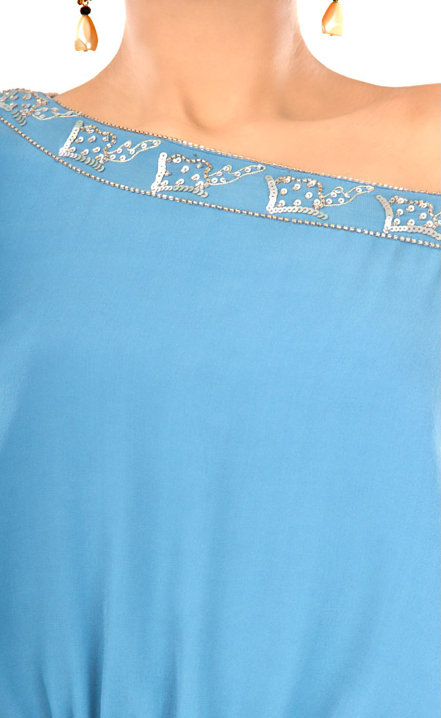 All eyes will be on you in this mykonos blue, exquisitely detailed one off shoulder dress. This dress features an elegant and effortlessly trendy one off shoulder neckline, carefully embroidered with beads and sequins giving a subtle and sophisticated look that exudes glamour. It has full sleeves that are gathered around the cuff, slightly ruched drawstring insertion along the waistline and a high slit at one of it's sides making this dress suitable for any occasion. 