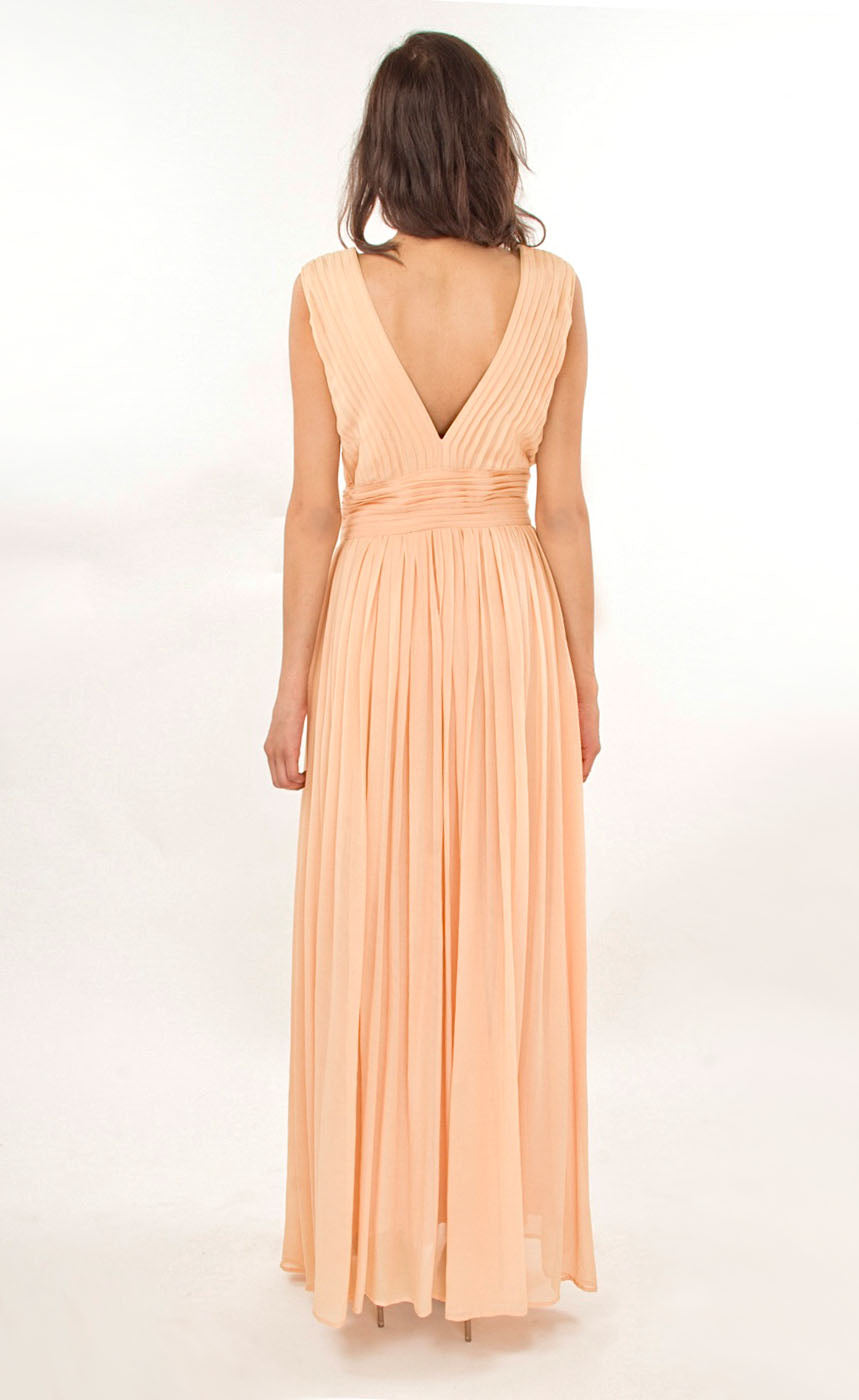 This nude elegant flowy floor-length gown has simple v-neckline bringing out a certain amount of boldness and self assurance. It is pin-tucked at the yoke and waistline making it an ideal go-to gown for any evening cocktail event. 