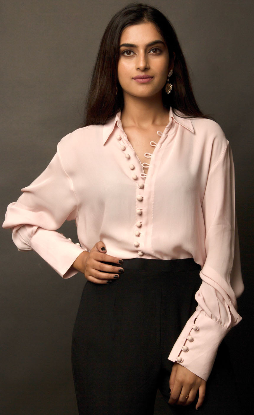 This powder pink classic loop-buttoned business shirt crafted in cupro georgette, with gathered full sleeves, focuses on the modern muse and exudes a sophisticated touch of classic. With its beautiful drop shoulders, it adds a sense of creativity to your shirt style. 