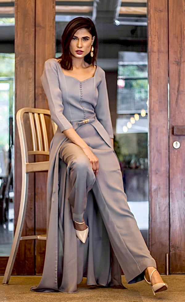 This is our alluring sandstone grey front slit dress. The lightweight drapey georgette makes it ideal to wear for any occasion. This is flattering full sleeved front slit dress with a beautiful buttoned sweetheart neckline giving you the perfect bloom when worn. It is ideal for business evening dinners/cocktail parties & formal events giving you all the attention you deserve.   