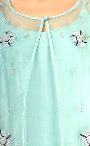 The muse here is wearing our sea green dress with an embroidered jacket. Embracing the era of comfort this dress is nothing short of luxury and glamour. The jacket carries subtle thread embroidery just enough to enhance it subtly. It is accompanied with a strapped flowy cupro slip underneath, just to make it elegantly sheer.