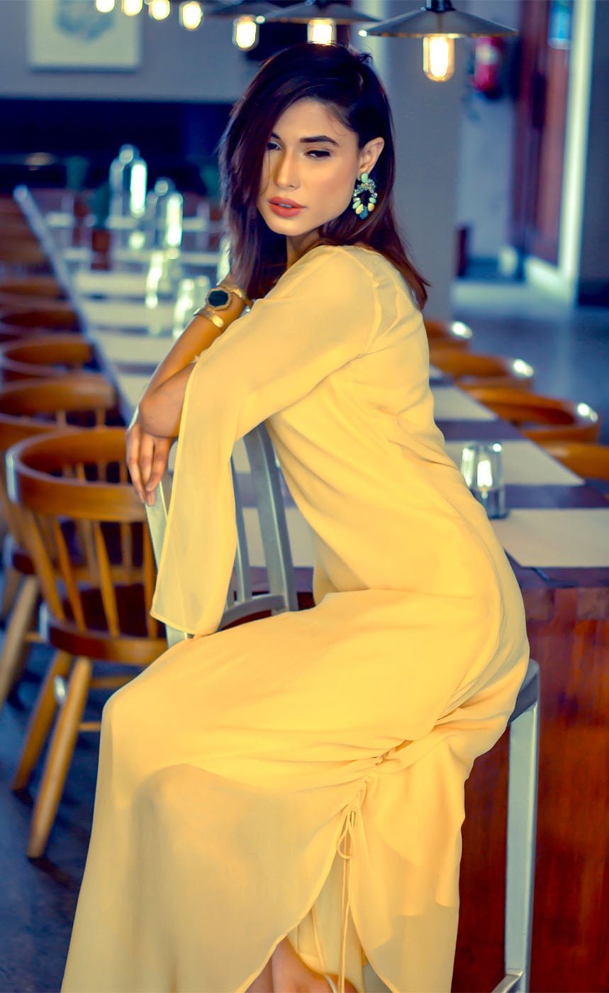 This is our tuscan yellow side drawstring dress which has all the flowy vibes which is a perfect dress for any event, bearing bead-work embroidery vertically on one sleeve and slit on the other to reveal your little glam and sparkly mood making it a beautiful lounge or an evening wear. The dress further has adjustable drawstring at one of it's sides providing a simple and elegant look.