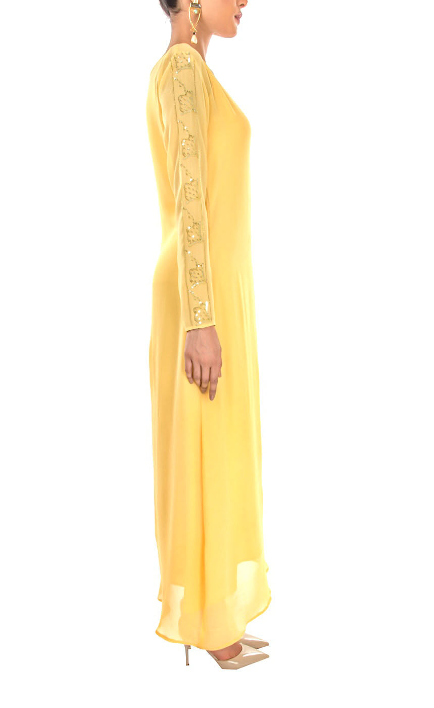 This is our tuscan yellow side drawstring dress which has all the flowy vibes which is a perfect dress for any event, bearing bead-work embroidery vertically on one sleeve and slit on the other to reveal your little glam and sparkly mood making it a beautiful lounge or an evening wear. The dress further has adjustable drawstring at one of it's sides providing a simple and elegant look.